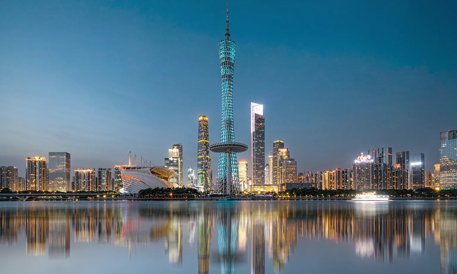 The Guangzhou skyline at blue hour, seen across the Pearl River